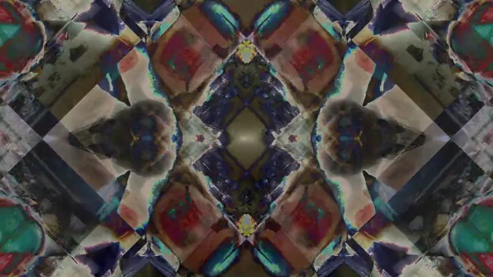 Dark kaleidoscope of mirrored red, teal and cream shapes